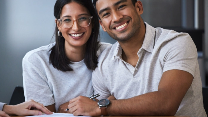 couples signing cohabitation agreement