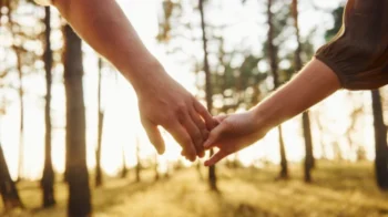 partners on unmarried partner visa uk holding hands