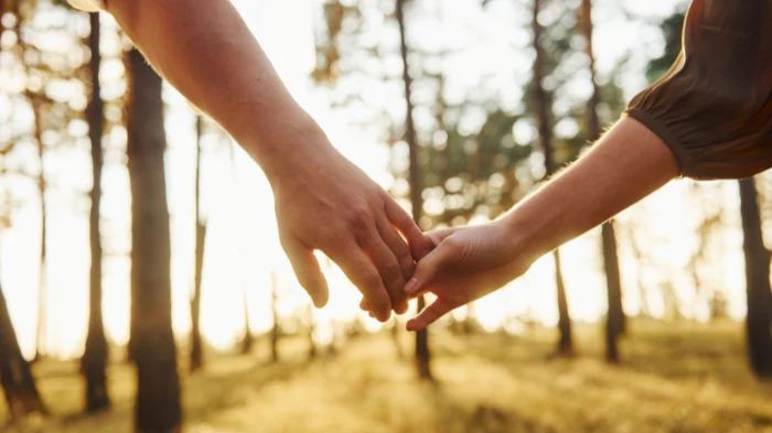 partners on unmarried partner visa uk holding hands
