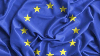 ruffled eu flag representing eu settlement scheme family permit